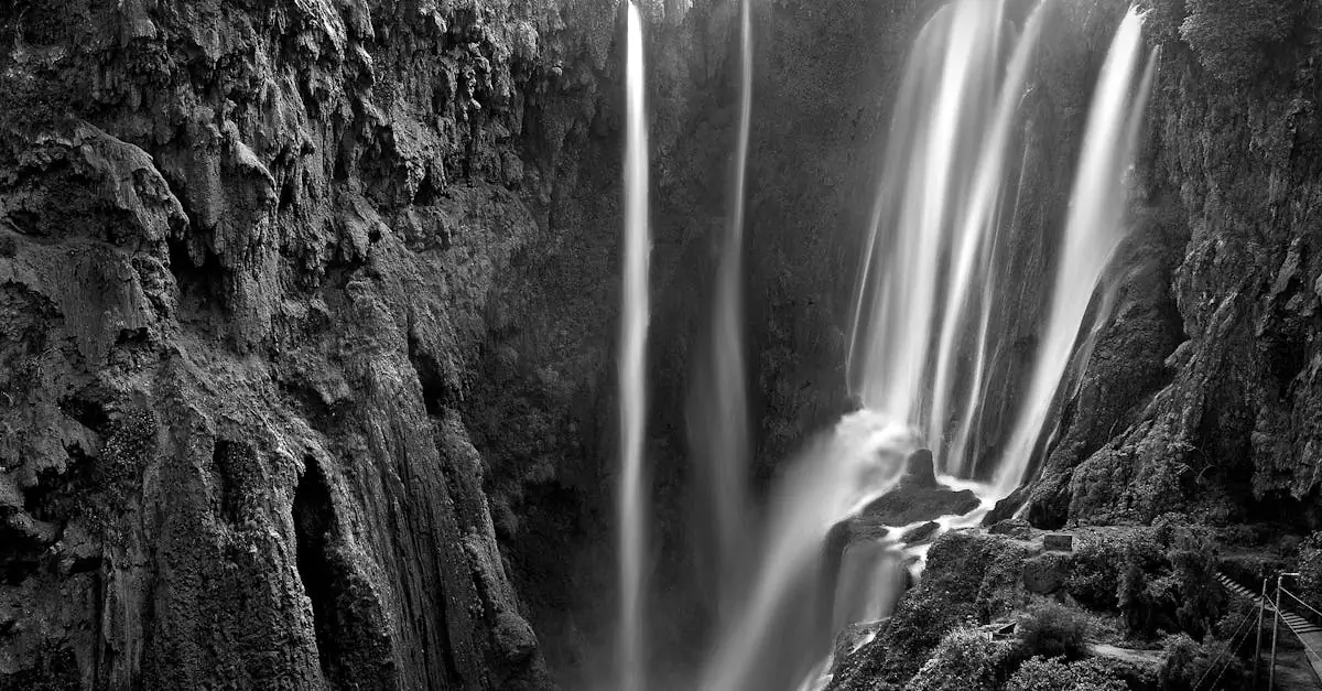 Black and white capture of the scenic Ouzoud Falls in Beni-Mellal, Morocco.