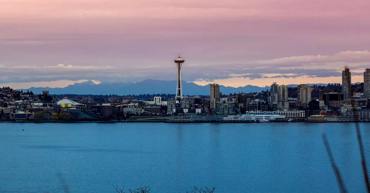 Stunning view of Seattle skyline featuring the Space Needle during sunset over the waterfront.