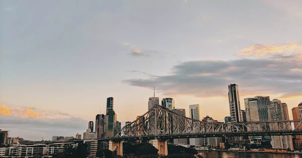 Scenic view of Brisbane skyline with Story Bridge at twilight over the Brisbane River.