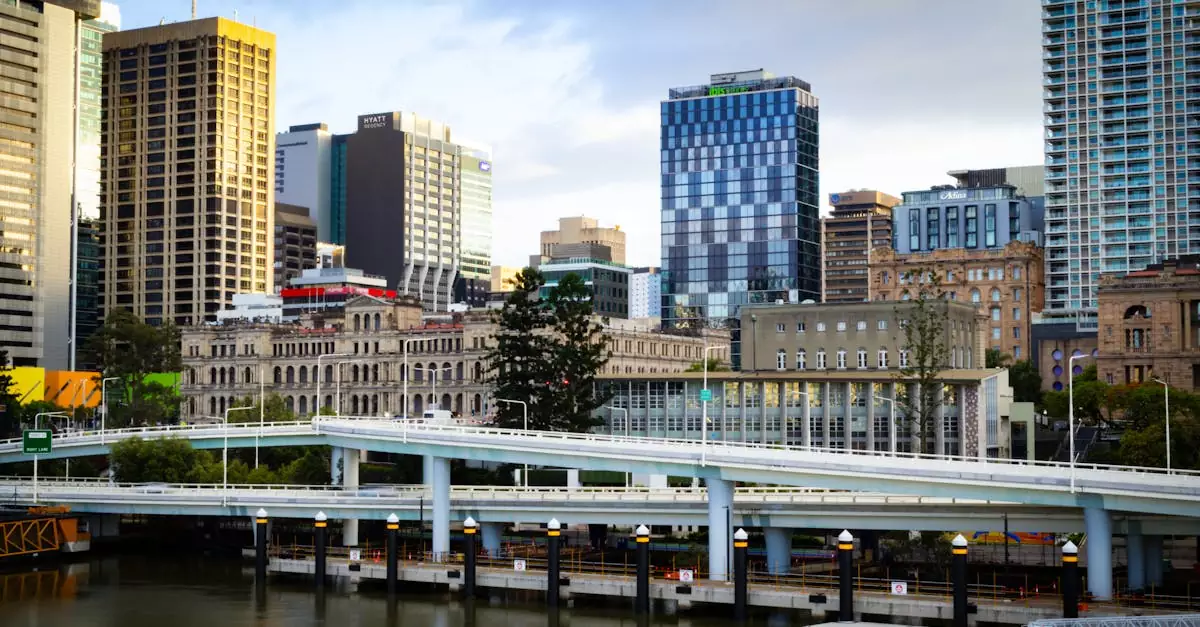 Vibrant Brisbane cityscape showcasing skyscrapers and iconic river bridge.
