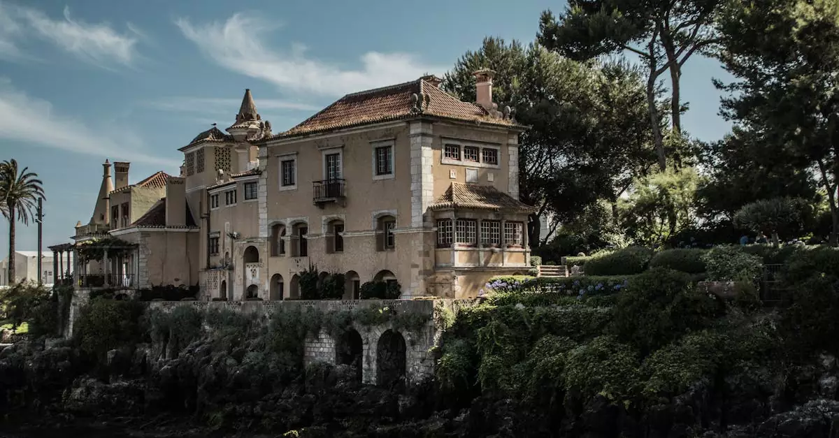 Casa de Santa Maria in Cascais by the sea, surrounded by lush greenery.