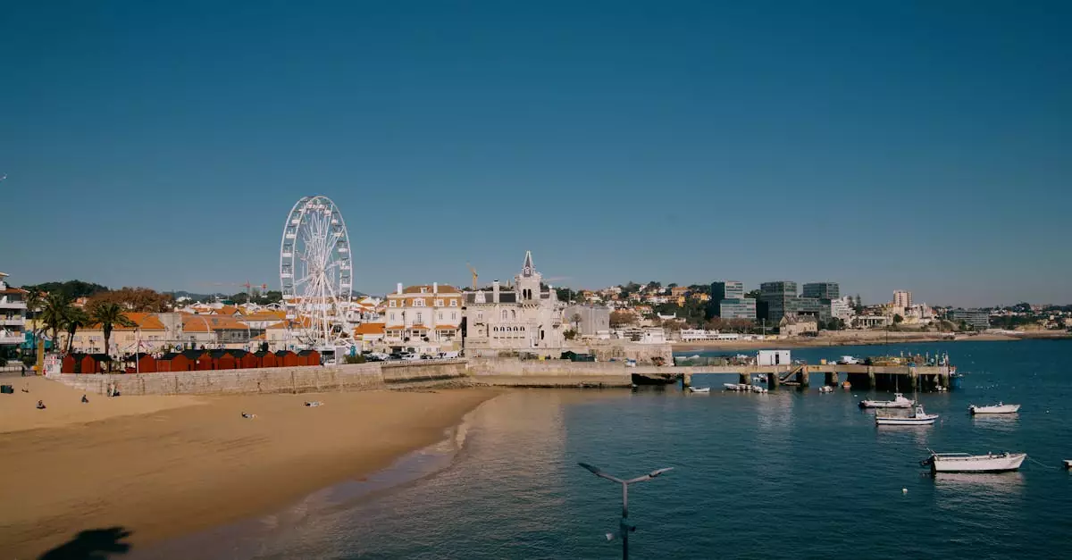 A stunning aerial view of Cascais with its beach, Ferris wheel, and historic buildings by the sea.