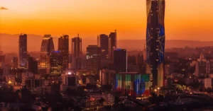 Stunning view of Addis Ababa's skyline against a vibrant sunset backdrop.