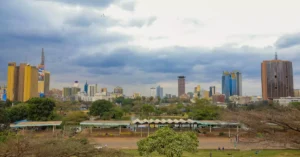 Scenic skyline view of Nairobi cityscape with iconic skyscrapers and lush greenery.