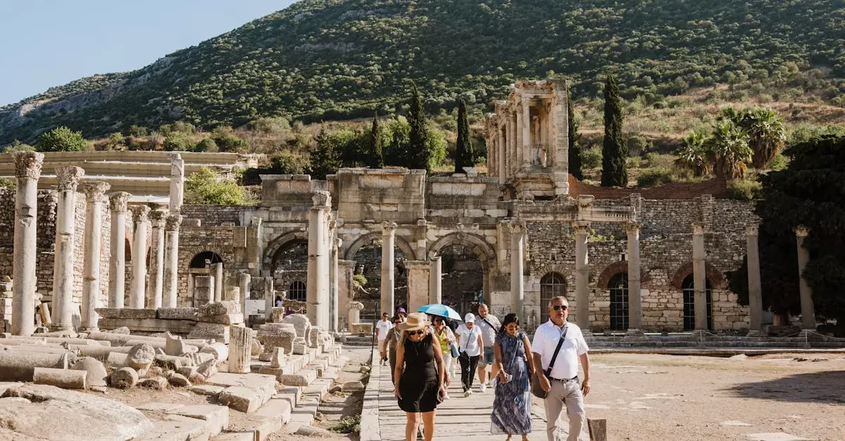 Tourists walk among ancient ruins in Ephesus, highlighting historical architecture and vibrant atmosphere.