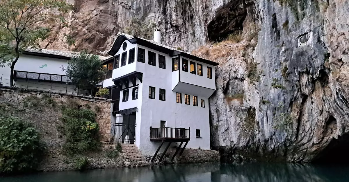Historic Blagaj Tekija positioned by a serene river and cliff.