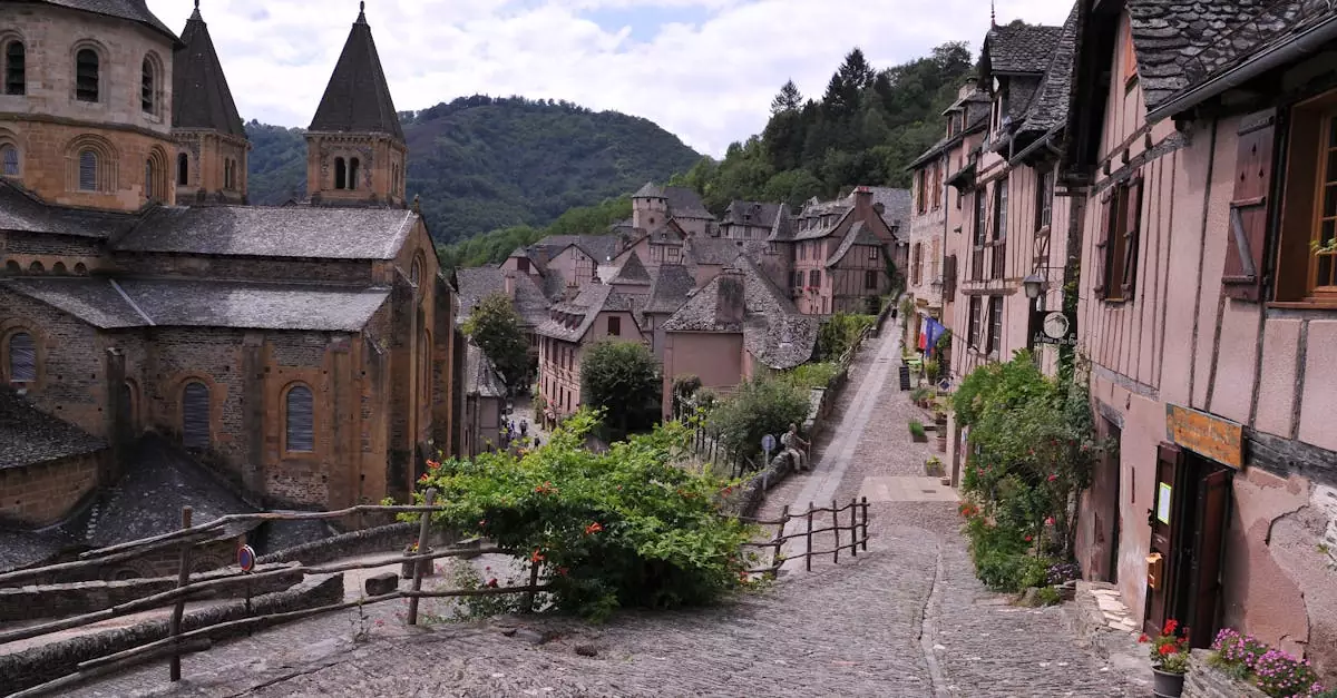 Explore the charm of a picturesque medieval village with historic stone buildings and lush greenery.