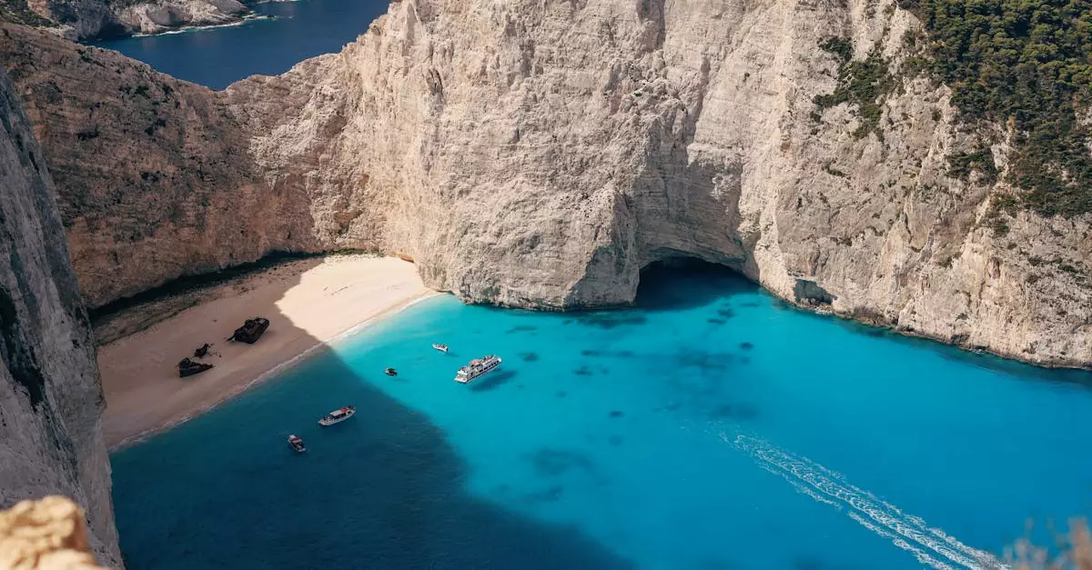 Stunning aerial view of Navagio Beach with crystal clear waters and scenic cliffs in Zakynthos, Greece.