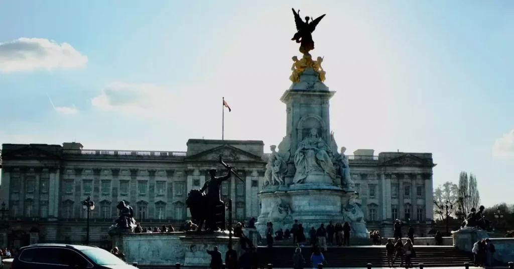 Queen Victoria Exhibit Buckingham Palace: Your Guide 2 Majestic view of Buckingham Palace and the Victoria Memorial in London, England with clear skies.