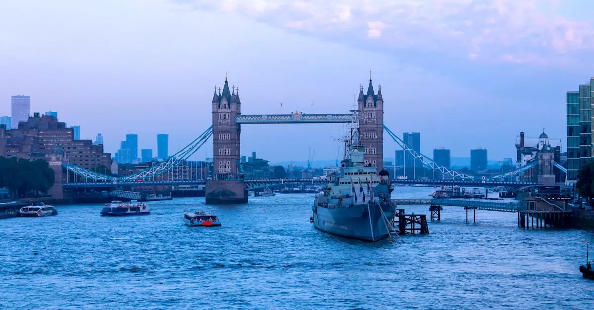 Scenic view of London's Tower Bridge at dusk, featuring the River Thames and cityscape.