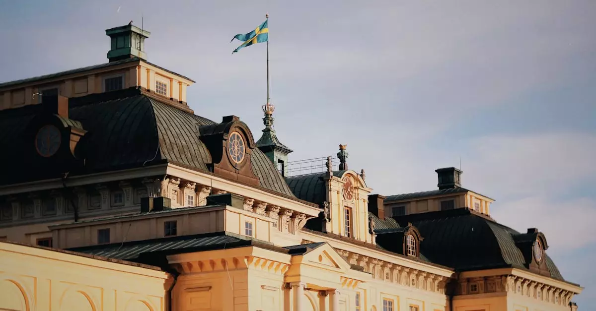 Drottningholm Palace with Swedish flag against a clear autumn sky. Iconic Swedish architecture.