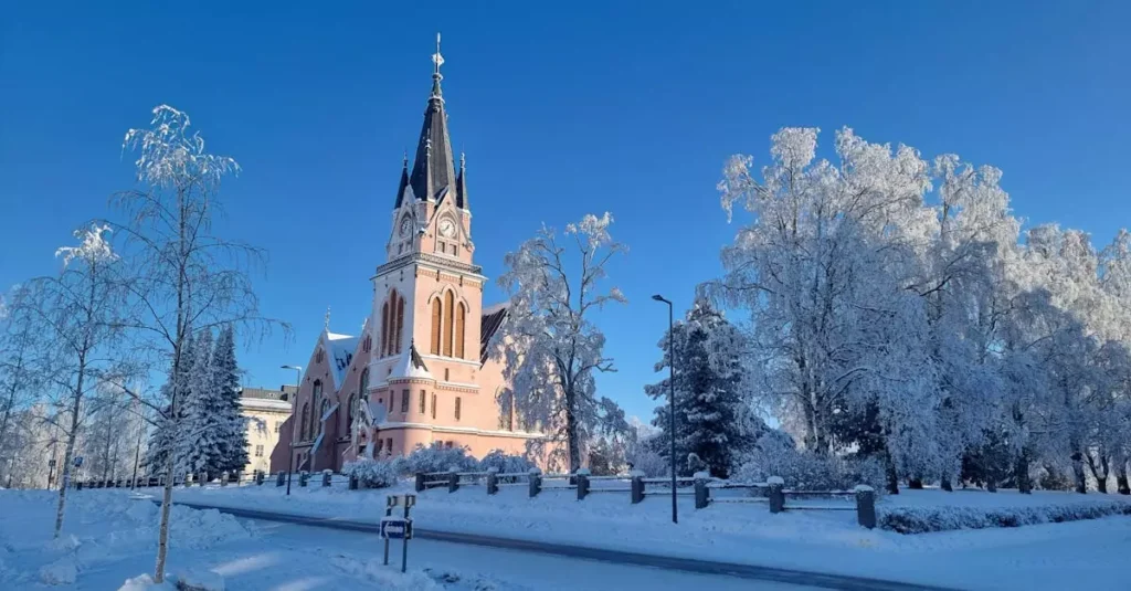 Beautiful snowy church in a serene winter landscape, Lapland, Finland.