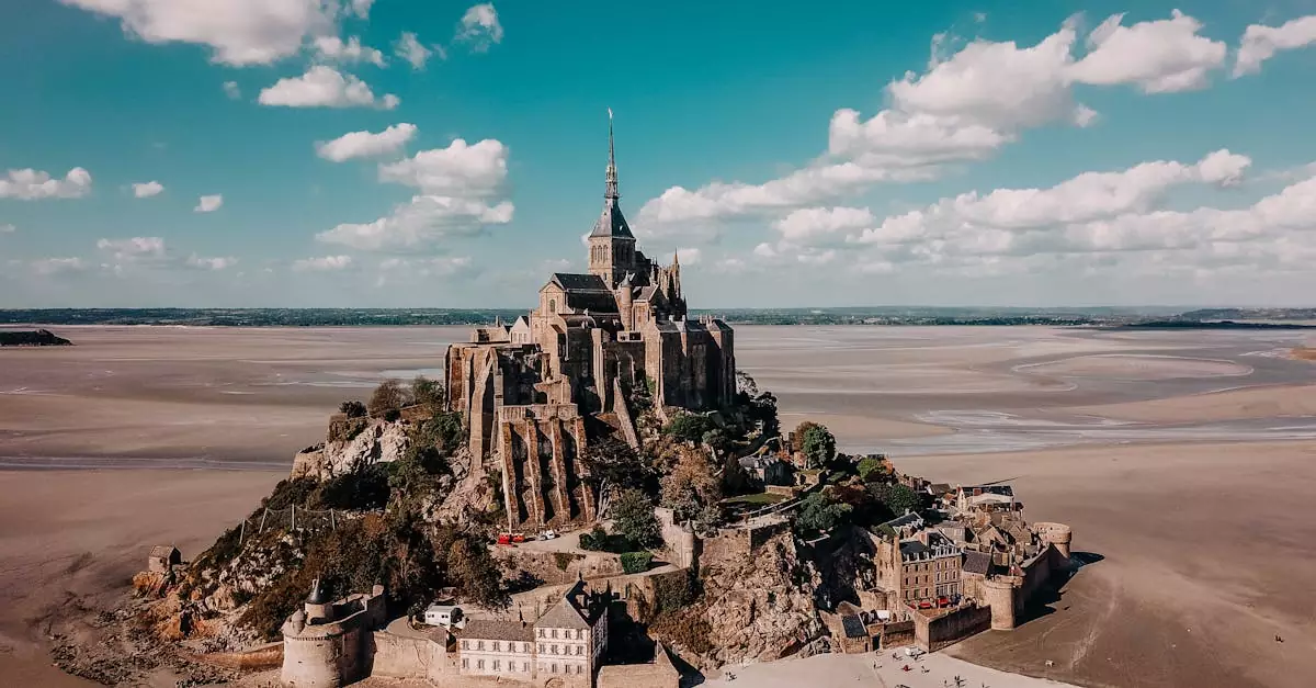 Stunning aerial view of Mont Saint-Michel, a historic abbey and landmark in Normandy, France.