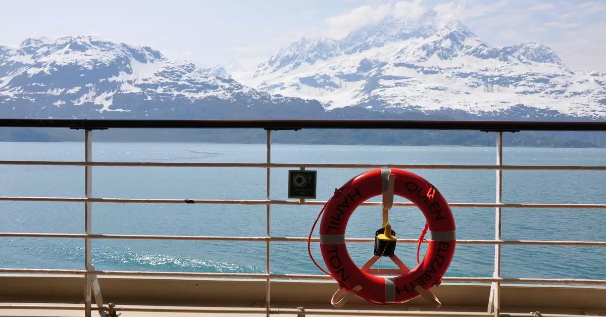 Scenic view of snowy mountains from a cruise ship in Alaska, highlighting nature's beauty.