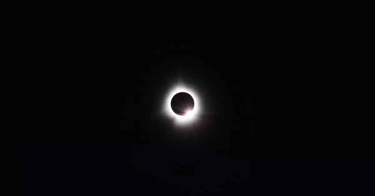 Dramatic total solar eclipse captured over Magog, Canada showcasing the moon obscuring the sun.