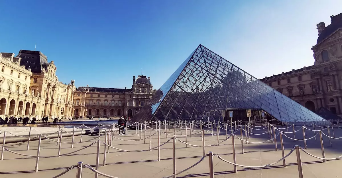 Louvre Pyramid in Paris with bright sky, showcasing iconic architecture and clear reflections.