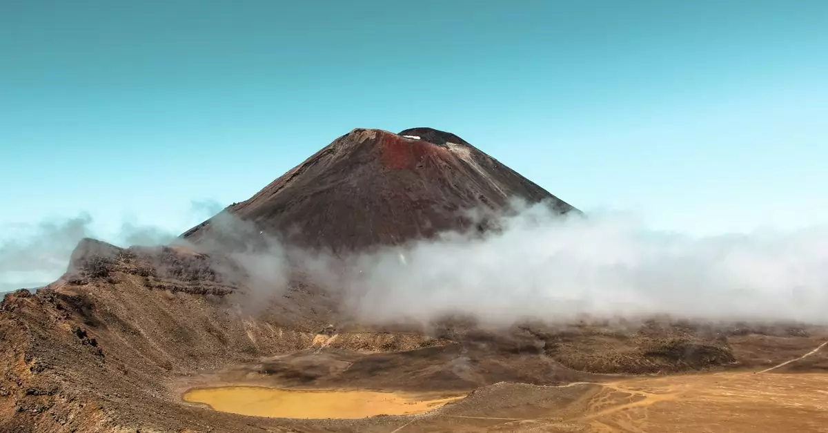 Stunning view of Mount Ngauruhoe surrounded by mist in Tongariro National Park, New Zealand.