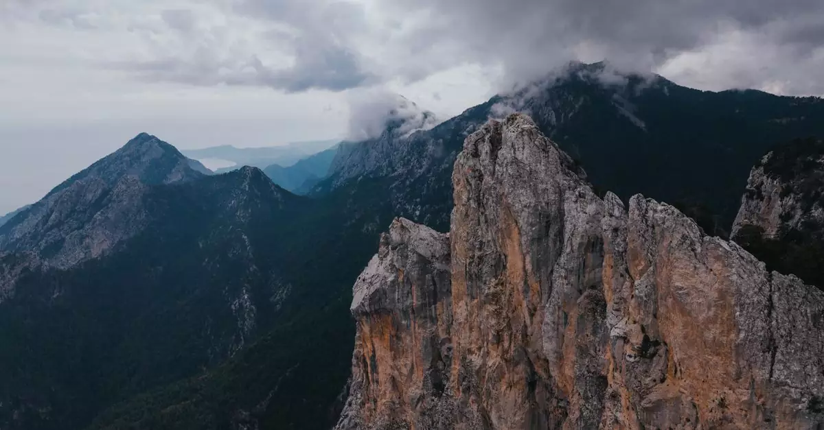 Stunning view of rocky mountain peaks under cloudy skies in Turkey's Taurus Mountains.