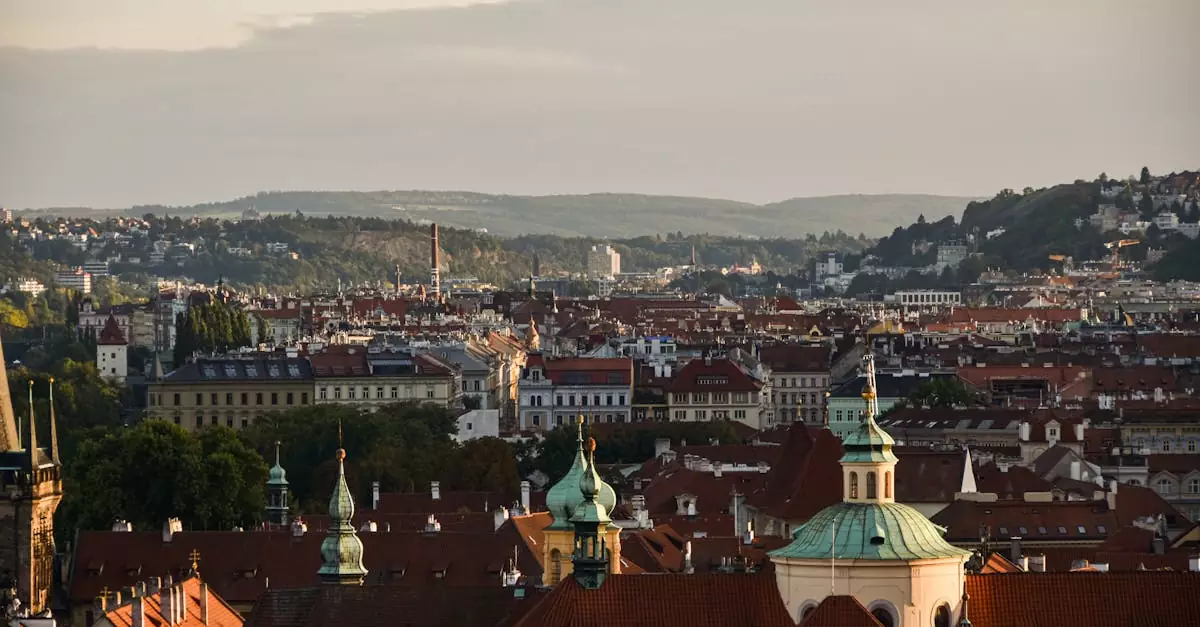 Stunning aerial view of Prague's historic cityscape at sunset, showcasing iconic architecture.
