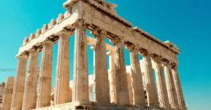 Impressive view of the ancient Parthenon in Athens against a clear blue sky.