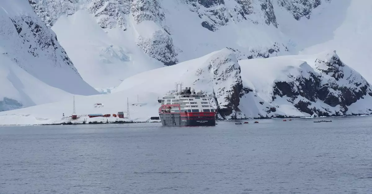 A cruise ship navigating through icy waters surrounded by majestic Antarctic icebergs.