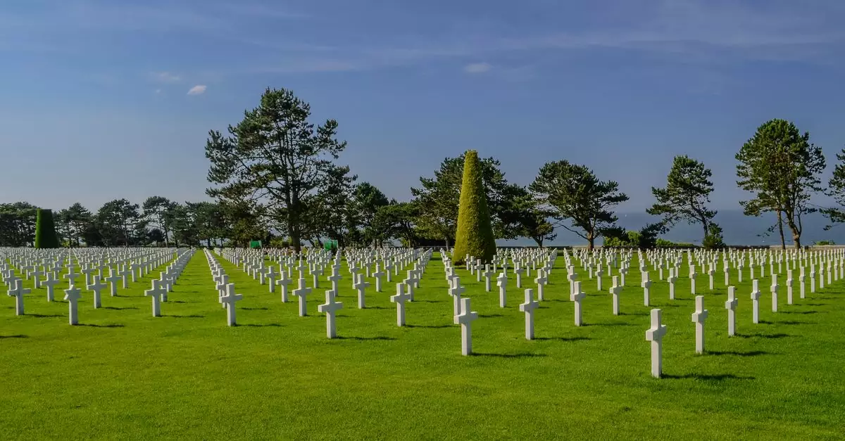 Wide view of the American Cemetery in Normandy, depicting rows of crosses honoring WWII soldiers.