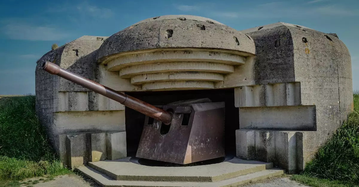 Photograph of a World War II bunker with a cannon in Normandy, France.