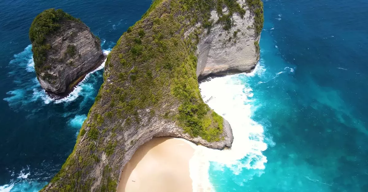 A breathtaking aerial shot of Nusa Penida's coastal cliffs and turquoise waters.