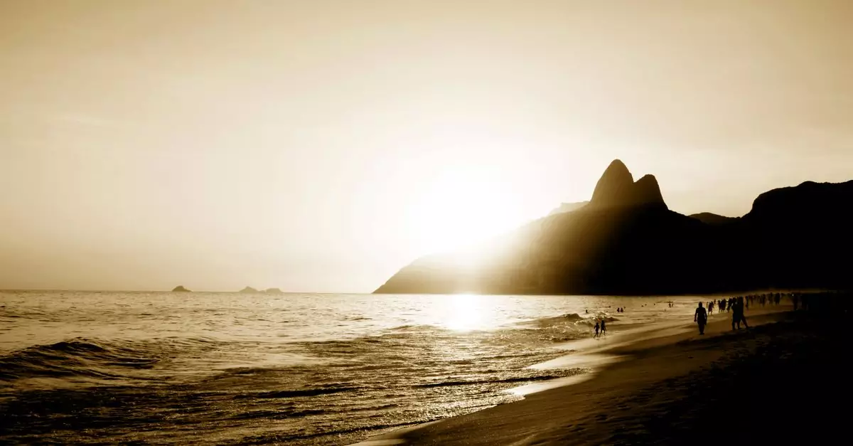 A serene sepia sunset over Ipanema Beach with silhouettes of Dois Irmãos mountain in Rio de Janeiro.