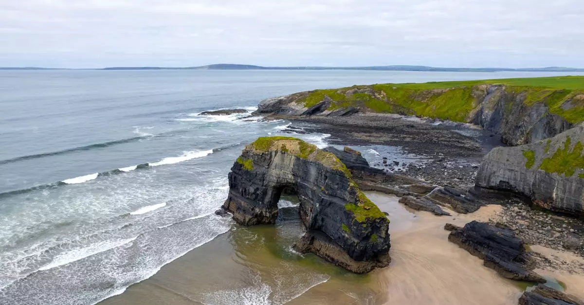 Stunning aerial view of the iconic sea arch at Ballybunion, Ireland's rugged coastline.