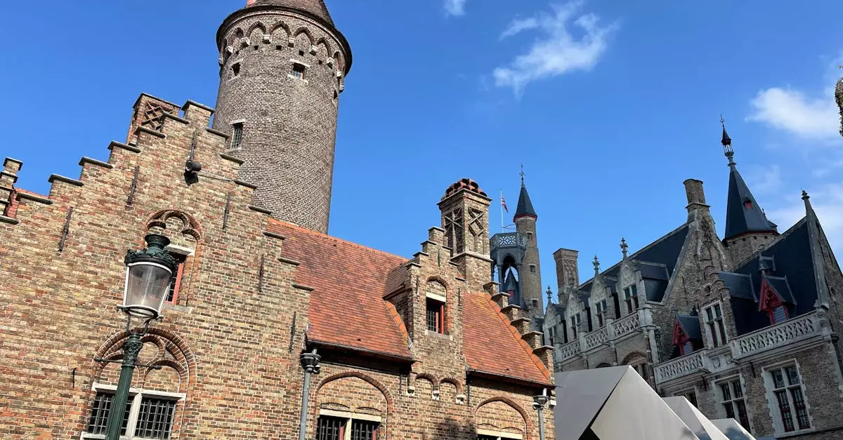 Explore the stunning brick architecture of the Gruuthusemuseum in Bruges, Belgium under a bright blue sky.