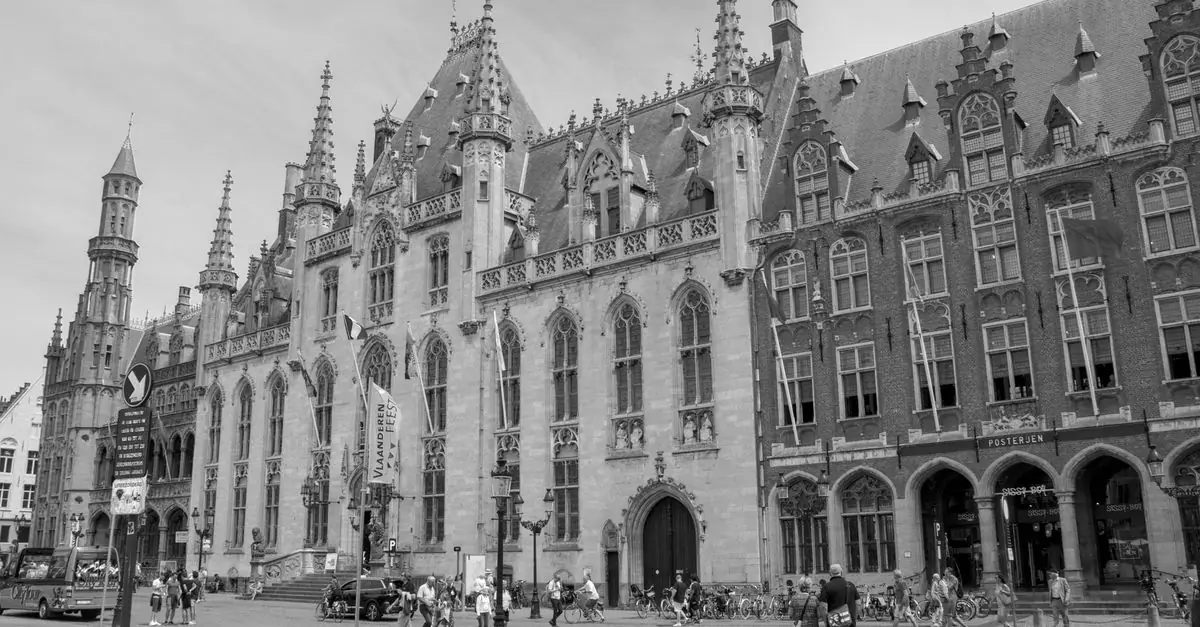Black and white photo of Gothic architecture in Bruges, showcasing the city's rich history and grand design.
