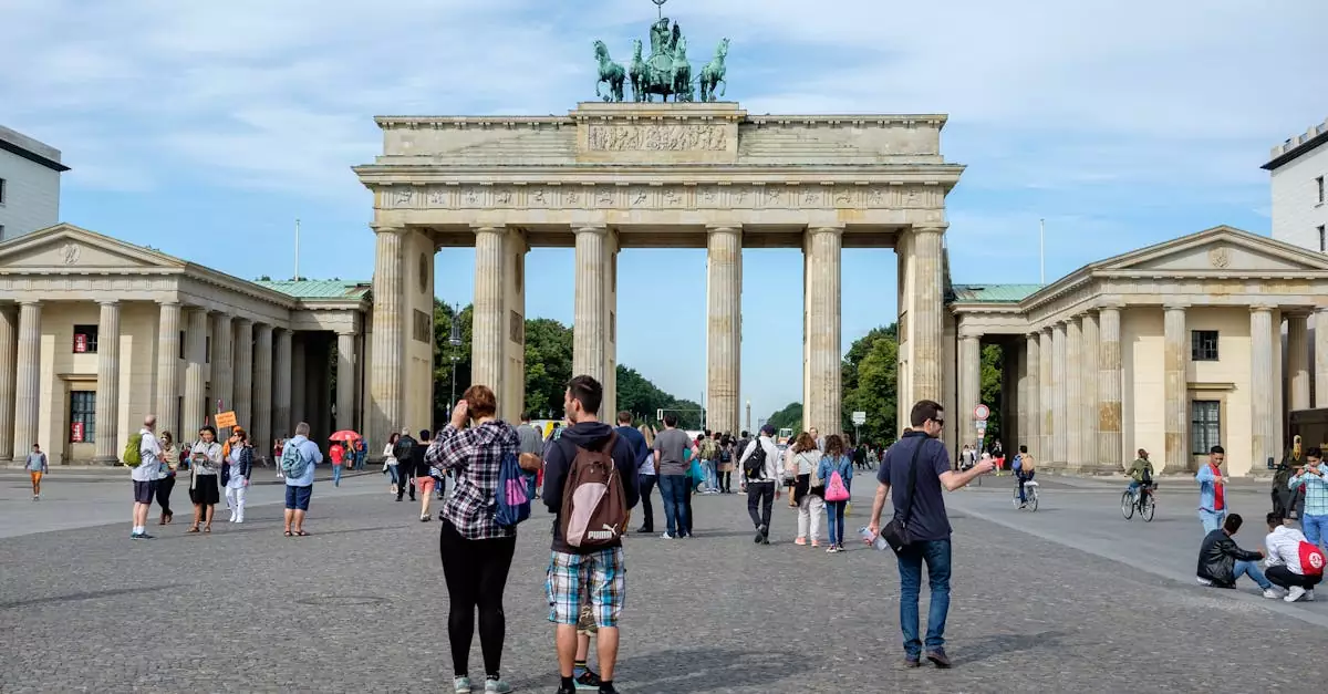 Visitors explore the iconic Brandenburg Gate in Berlin, Germany.