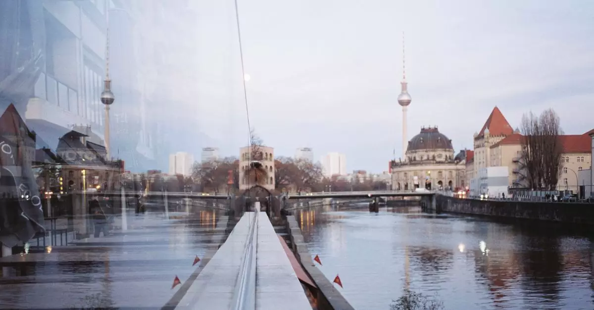Beautiful view of Berlin's Spree River with reflections of Fernsehturm at twilight.