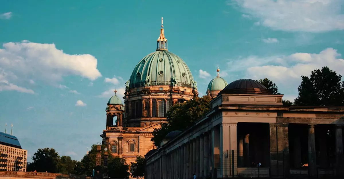 Capture the elegance of Berlin Cathedral with a serene river view during sunset.