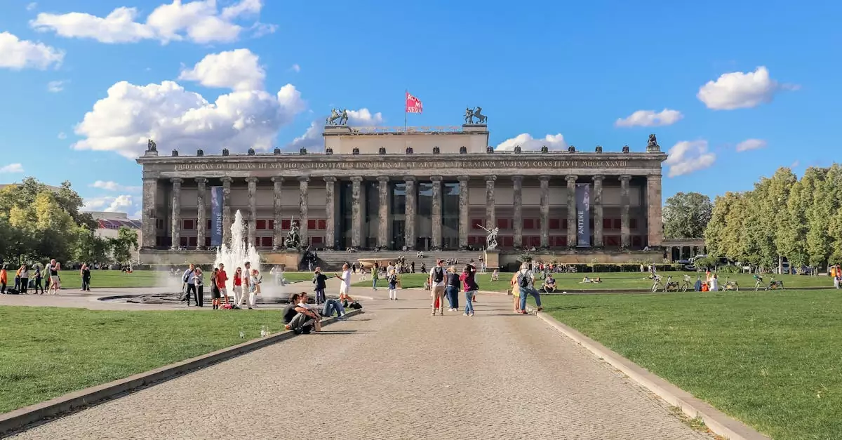 View of the Altes Museum in Berlin with people enjoying the sunny day.