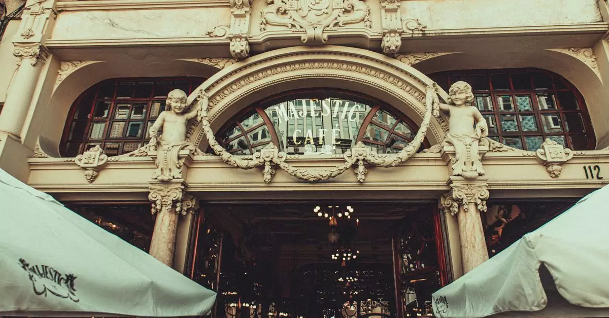 Elegant facade of Majestic Caf&eacute; in Porto showcasing classical architectural details.