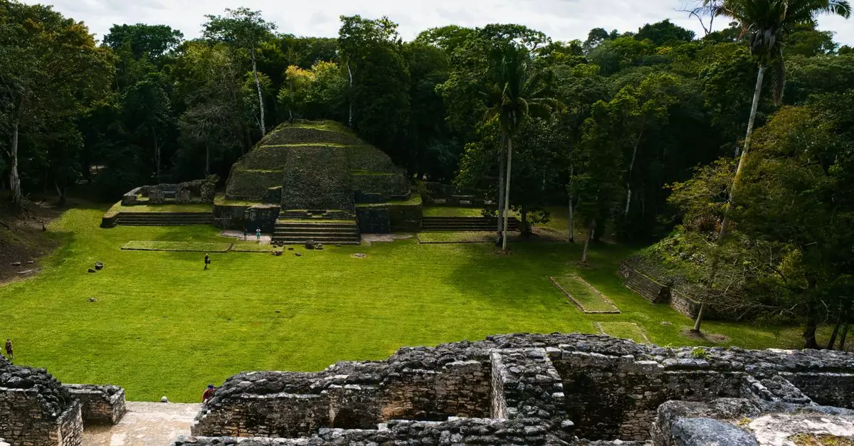 Explore the ancient Mayan ruins at Xunantunich surrounded by lush Belizean jungle.