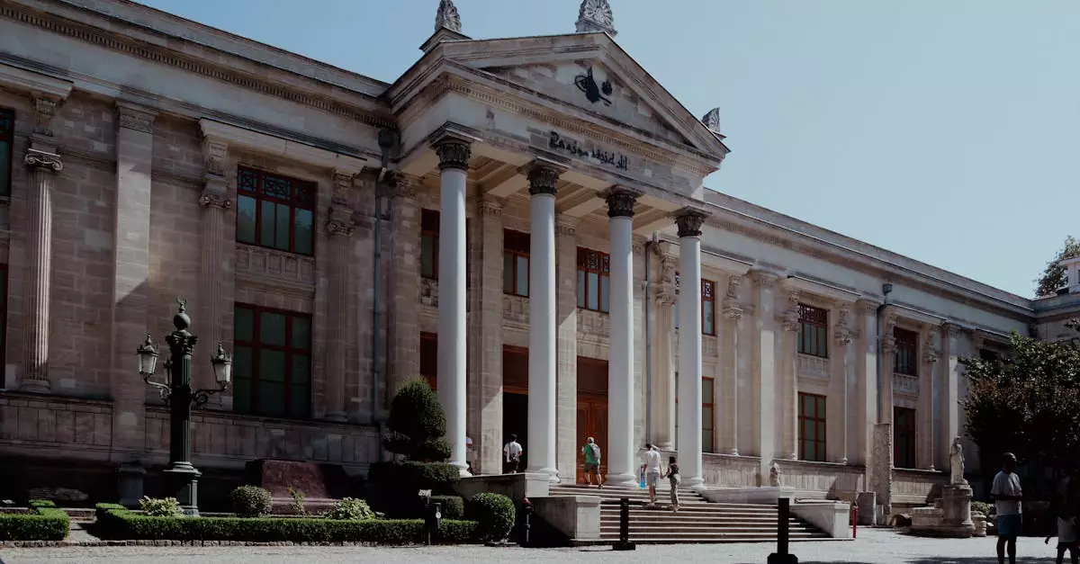 Exterior view of Istanbul Archaeology Museum showcasing neoclassical architecture bathed in daylight.