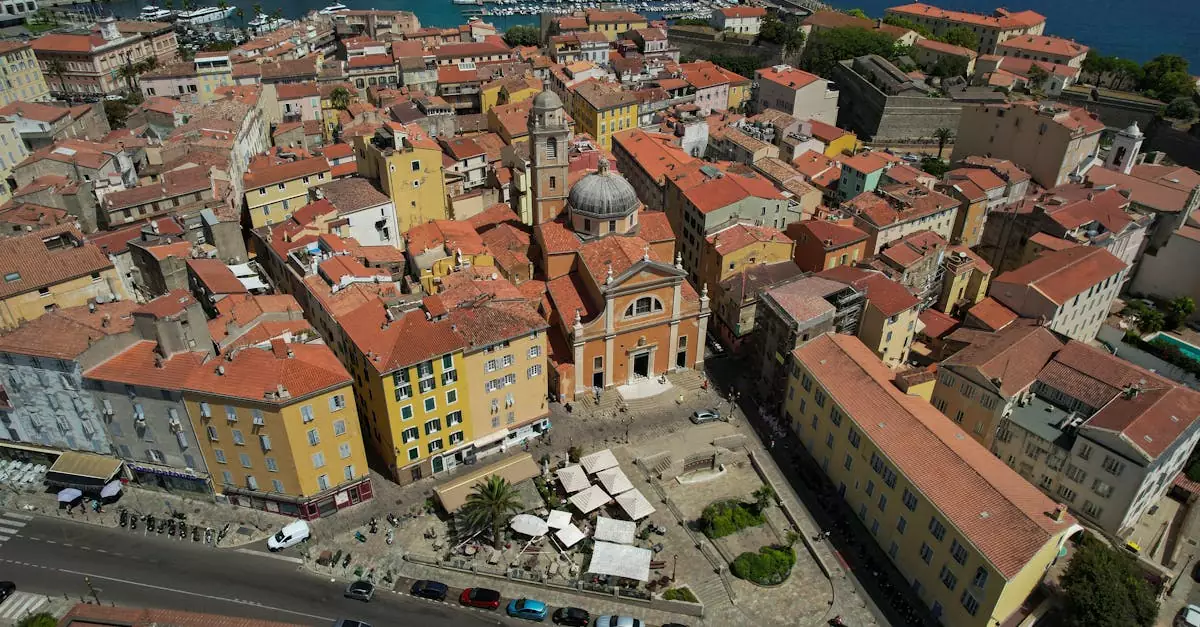 Stunning aerial view of Ajaccio showcasing historic architecture with vibrant rooftops by the coast.