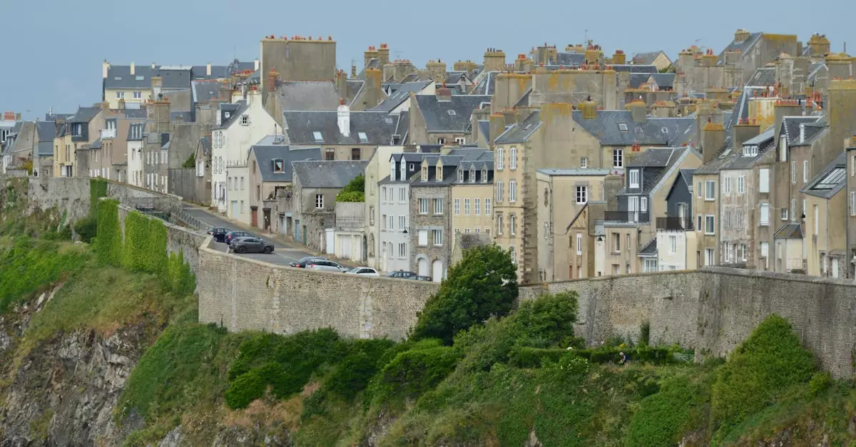 Ancient coastal town with unique stone buildings on a cliffside.