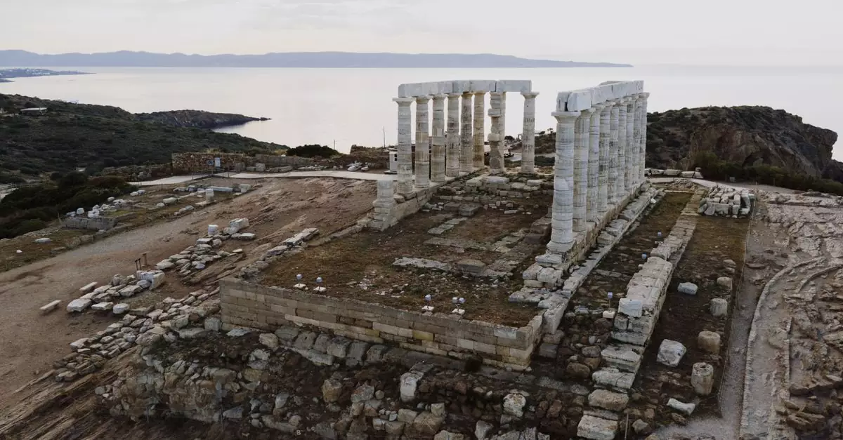 Aerial photograph of the ancient Temple of Poseidon at Cape Sounion, Greece, overlooking the Aegean Sea.