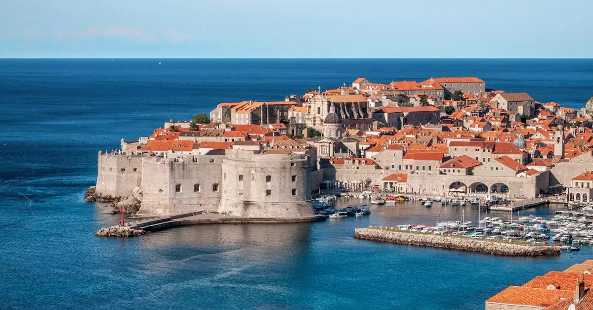 A stunning aerial shot of Dubrovnik's old town and harbor, showcasing historical architecture.