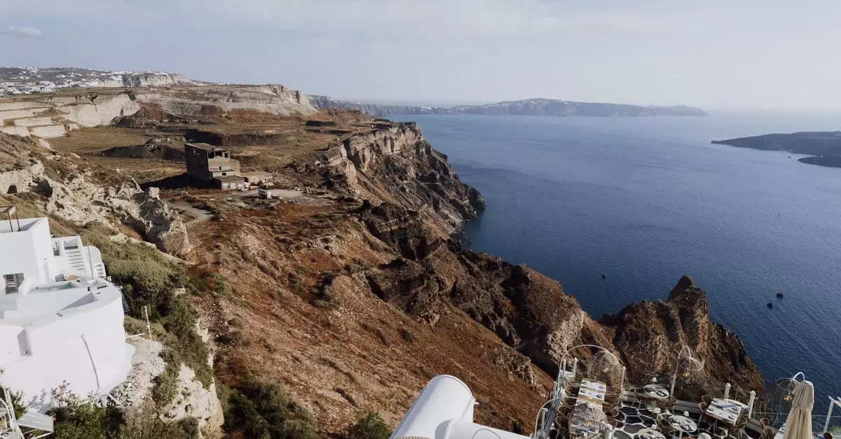 Stunning landscape of Fira's cliffs overlooking the Aegean Sea in Greece.