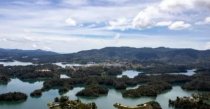 A breathtaking aerial shot of Guatapé Reservoir showcasing its intricate network of islands and lush landscape.