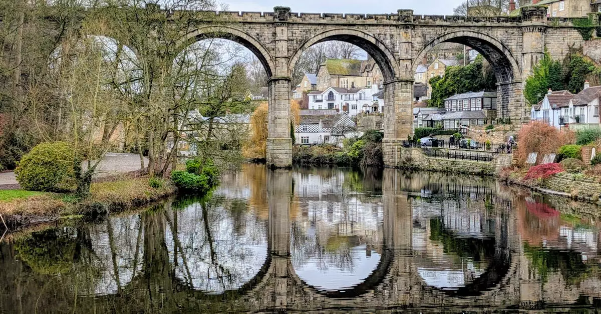 Scenic view of Knaresborough Viaduct reflecting on the River Nidd in England.
