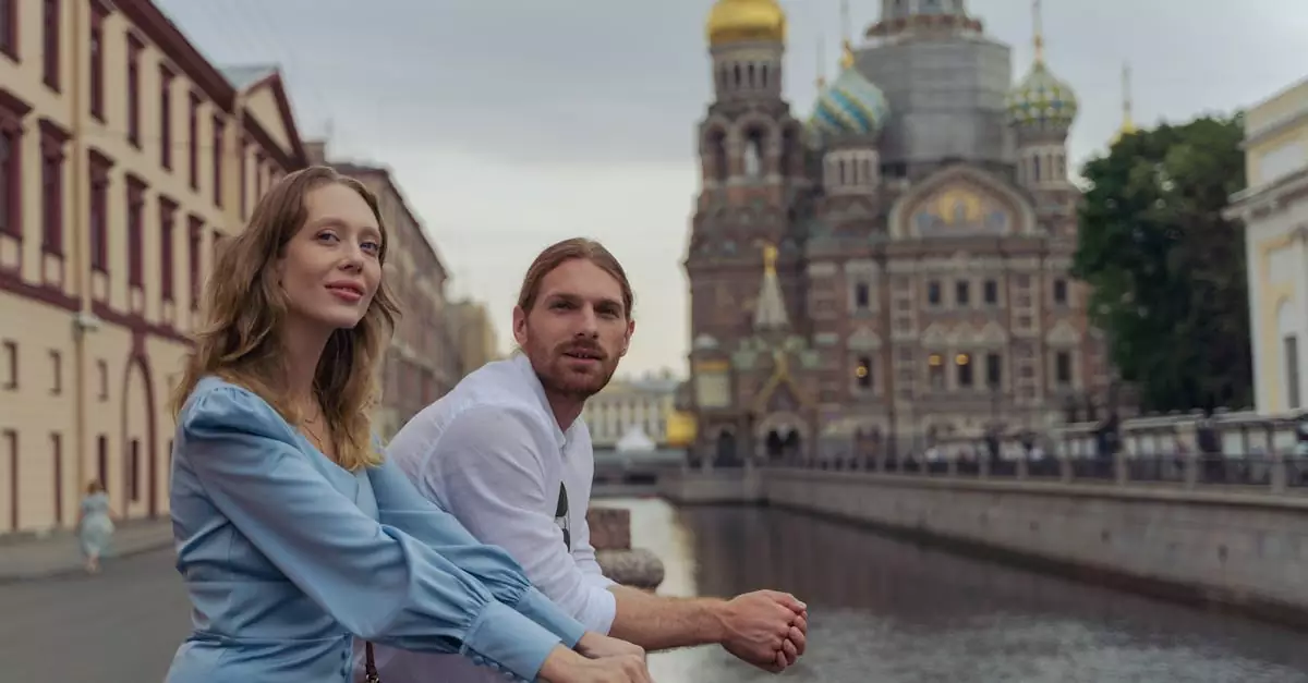 A couple enjoys a scenic view on a bridge near the Church of the Savior on Blood in Saint Petersburg.