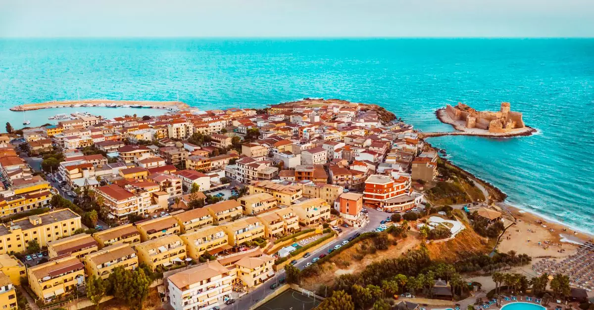 Explore the stunning coastal landscape of Capo Rizzuto in Calabria, Italy, featuring historic fortresses and vibrant towns.