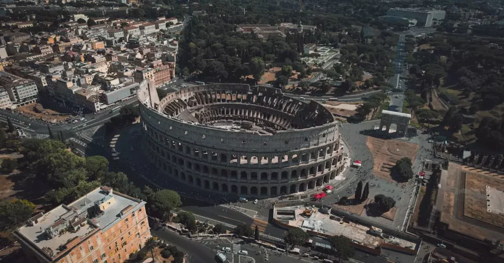 Best Cultural Destinations in Europe: Your Guide 2 High angle drone shot of the Colosseum in Rome, Italy, showcasing its grandeur and surrounding urban landscape.