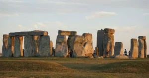 Explore the iconic Stonehenge monuments at sunset, a marvel of prehistoric England.